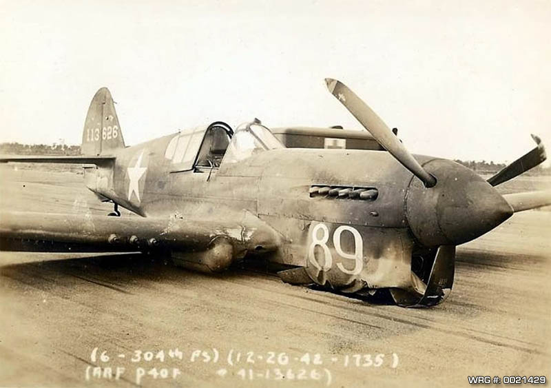 P-40F Warhawk/41-13626 of the 304th Fighter Squadron after a wheels up landing, December 26, 1942. WRG# 0021429