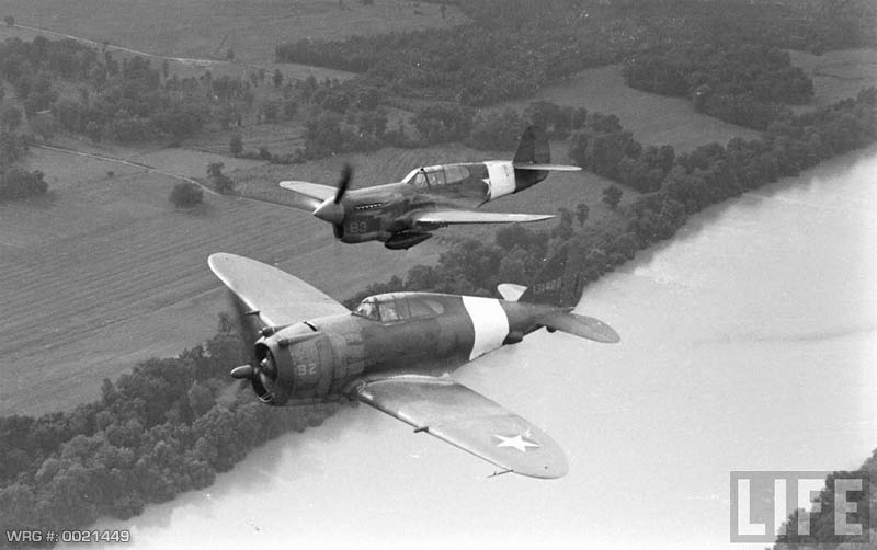 A Republic P-43 and a P-40 Warhawk flying during manuevers. WRG # 0021449