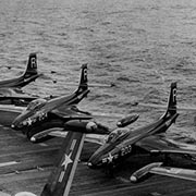 F2H-2 Banshees of Fighter Squadron (VF) 172 and an F9F-2P Panther of Composite Squadron (VC) 61 pictured on board the carrier Essex (CV 9) operating in the waters off Korea on September 15, 1951