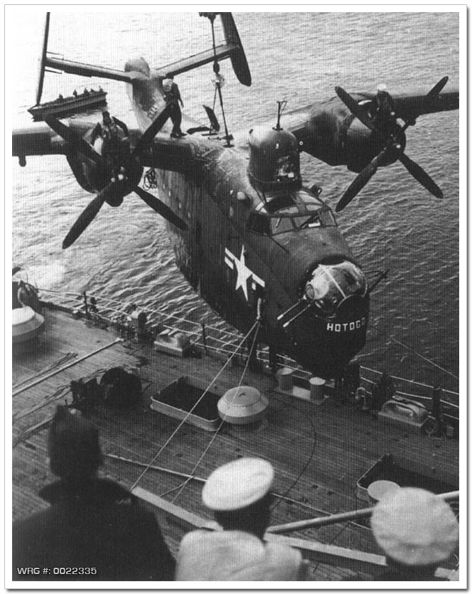 A U.S. Navy PBM of Fleet Air Wing 6 is hoisted aboard the seaplane tender USS Curtiss (AV-4) after a mine-hunting patrol off North Korea. WRG #: 0022335
