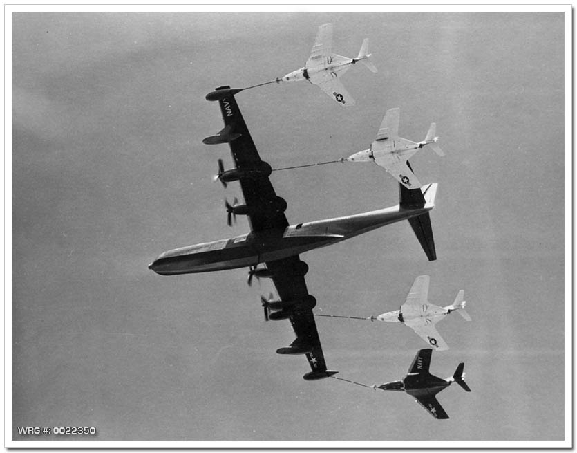 R3Y-2 Tradewind refuels a record four fighters in flight, 1956. WRG #: 0022350