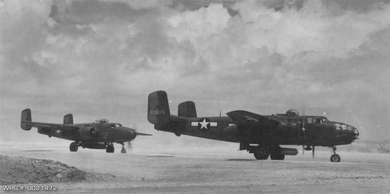 North American B-25's taking off for bombing missions to Saseba Harbor, Kyusuhu. First mission to use mark 13 torpedoes. 47th BS, 41st BG, Okinawa, Ryukyu Retto. July 28, 1945. WRG-0021472