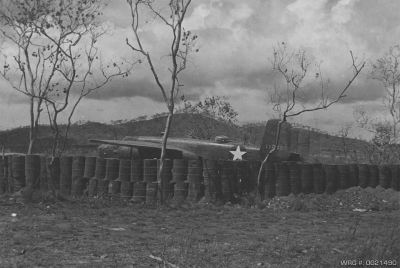 North American B-25C Mitchell/41-12485 in revetment at airfield near Port Moresby, PNG, 1943. WRG #:0021490