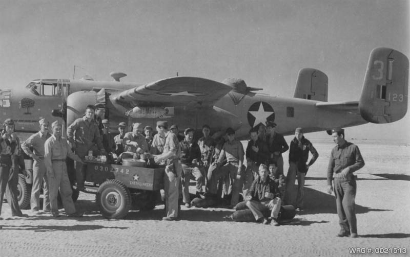 B-25 Mitchell in North Africa. members being served coffee. 1943. WRG #: 0021513