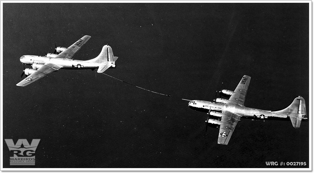 A KB-29M equipped with hose and drogue refuels a KB-29MR modified with a nose probe.