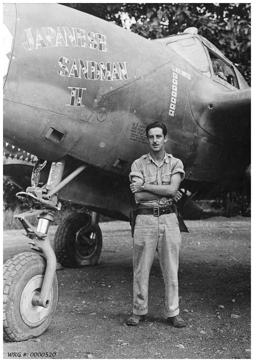 Lt Snuffy Smith Of the 39th FS with his P-38 Lightning Japanese Sandman II. WRG# 0000520